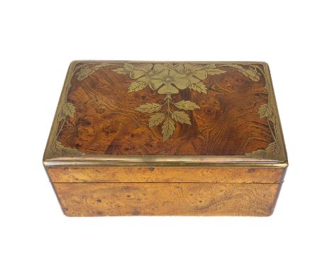 A Continental elm and brass inlaid trinket box. With etched floral and foliate inlaid lid, width 16cm.