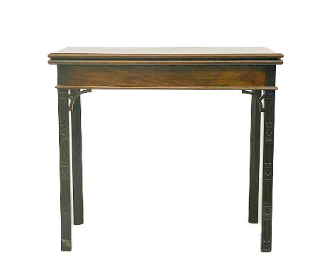 A 19th century mahogany fold over card table in the Chippendale manner. With pierced fretwork and blind fretwork carving to t