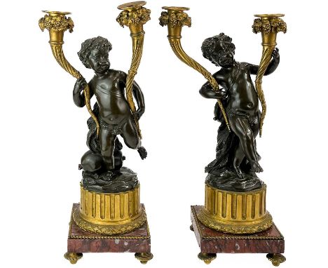 A pair of French bronze and ormolu figural candelabra, after Clodion. 19th century, modelled as two youthful Bacchanalian che