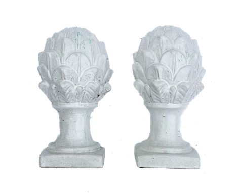 A pair of white ceramic cones of naturalistic form. Together with a pair of reconstituted stone cones. Both approximately 30c