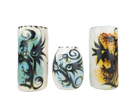 Two Celtic Newlyn pottery cylindrical vases. Each painted with stylised birds, one with a label, height 21cm, together with a