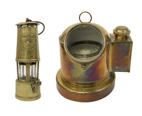 A Sestral brass ship's binnacle compass. Complete with burner, on a mahogany base, height 25cm, diameter of base 22cm, togeth