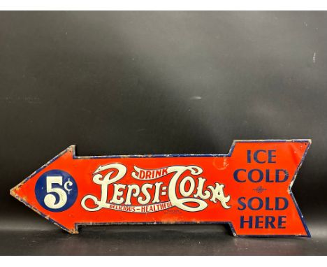 An American embossed tin directional arrow advertising sign for Pepsi-Cola, 27 x 9".