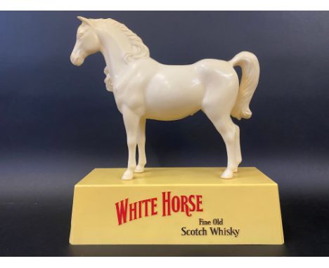 A White Horse Fine Old Scotch Whisky plastic counter top advertising figure, 10" h.