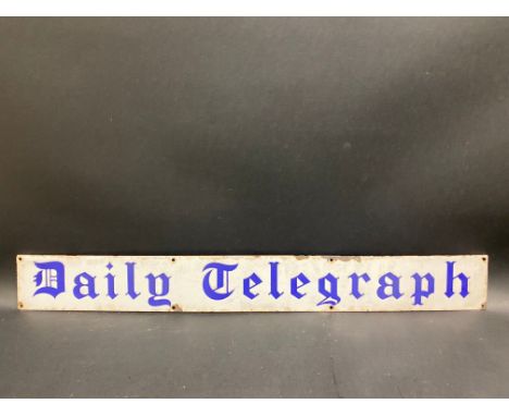 A Daily Telegraph narrow enamel strip sign, 30 x 3 1/2".