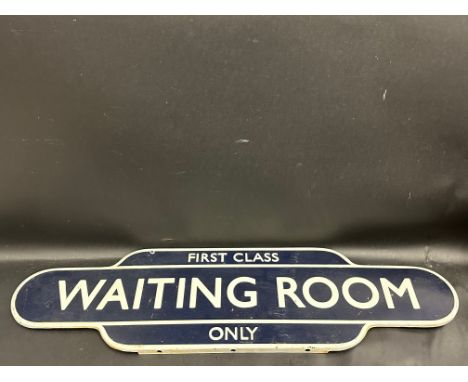 A reproduction railway station style totem enamel sign bearing the words 'Waiting Room First Class Only', 36 x 9 1/2".
