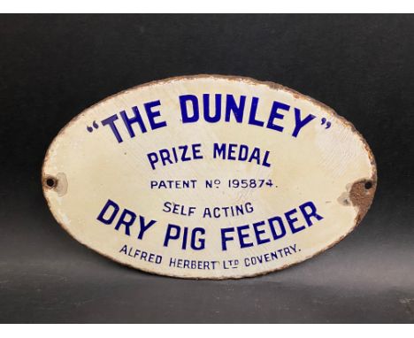 A small oval enamel sign 'The Dunley' Prize Medal Self Acting Dry Pig Feeder', 8 x 5".