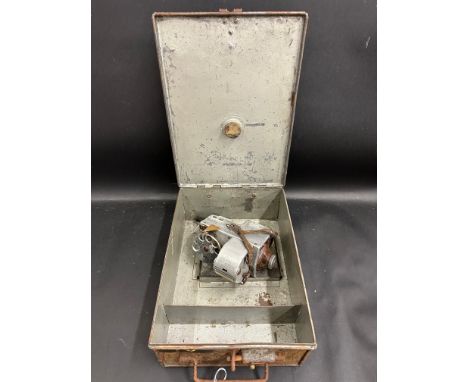 A bus conductor's ticket machine in original tin case.