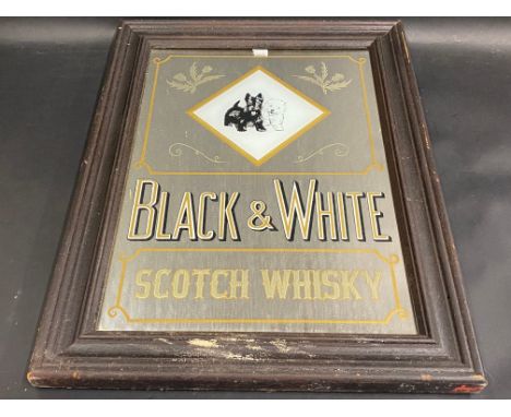 An older reproduction Black &amp; White Scotch Whisky advertising mirror, 15 1/2 x 20 1/2".