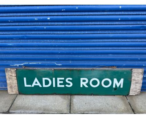 A British Railways Southern Region enamel station sign for Ladies Room, attached to a wooden board, 57 x 12" overall.