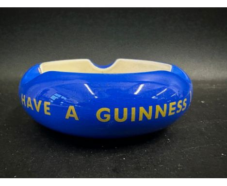 A Carltonware Guinness blue and white ashtray, 4" diameter.