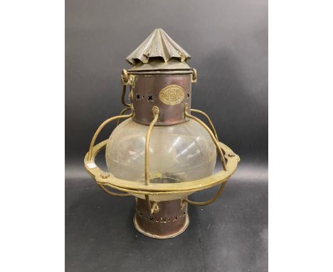 An unusual brass and copper lamp, by Hugh Douglas of Liverpool, converted to electricity, 13 1/2" h.