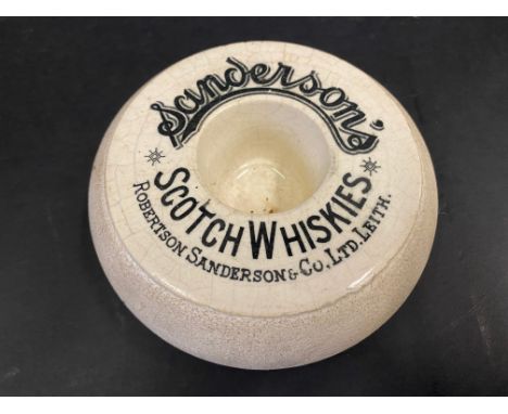 A Sanderson's Scotch Whiskies advertising match striker, 5" diameter.