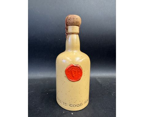 An unusual Carltonware Guinness stoneware bottle with red wax seal to the front, 7" h.