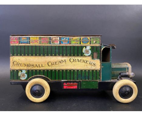 An early tinplate model of a delivery van advertising C.W.S. Crumpsall Cream Crackers, still retaining headlamp bulbs.
