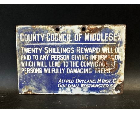 A small County Council of Middlesex enamel sign, 'Twenty Shillings Reward...leading to the conviction of persons wilfully dam
