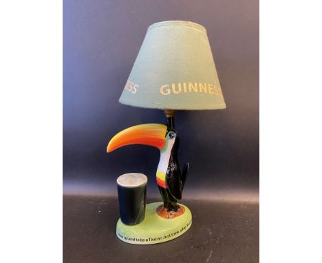 A Guinness Toucan table lamp with shade, by Carltonware, 15" h overall.