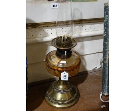 A Circular Brass Based Oil Lamp, With Clear Glass Reservoir