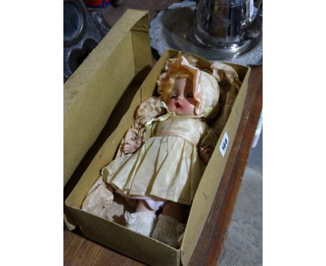 A Mid 20th Century Ceramic Head Doll With Jointed Limbs