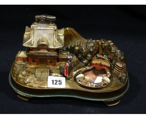 A Mid 20th Century Musical Table Lighter & Ashtray In The Form Of A Pagoda House & Pond