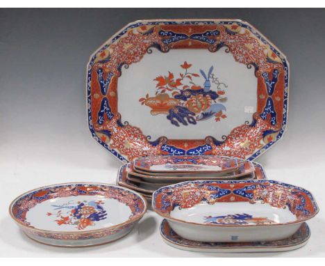 Spode platters in the Imari palette, a collection of 11 variously shaped platters, some with drainers. The largest measuring 