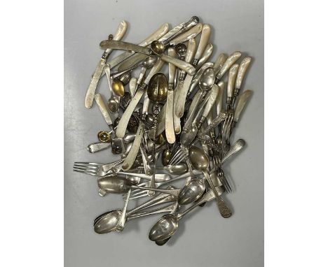 A set of silver tined and bladed and mother of pearl handled fruit eaters (12 x knives and 11 x forks), together with two mot
