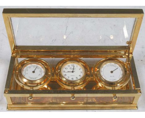 A Woodford weather station containing a quartz clock, thermometer and hygrometer, 15 x 7 x 4.5cm