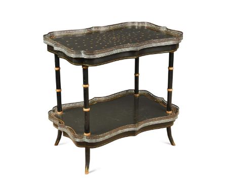 A Regency style ebonised two tier occasional table, the two scallop shaped tiers with pierced brass galleries raised on ring 