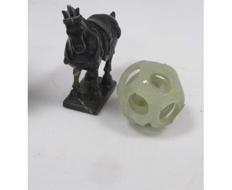 A jade-type puzzle ball decorated with fish forms; together with another green stone Tang style horse, 15.75cm high