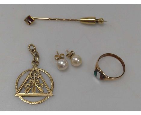 A pendant stamped ‘585’, a ring stamped ‘585’, gross weight 8.5g, together with a stick pin, tested as 18ct gold with a base 