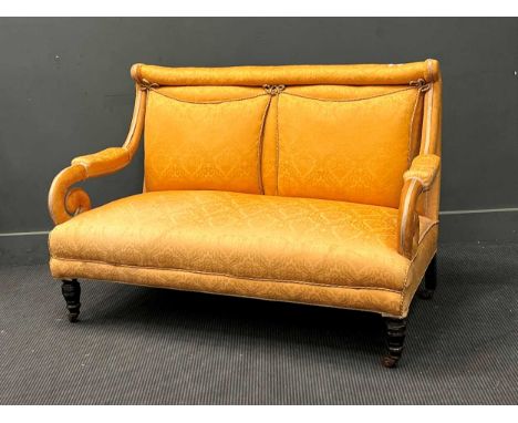 A late Victorian scroll arm two seat sofa, on turned legs and casters, 135cm wide, together with a matching armchair, an easy