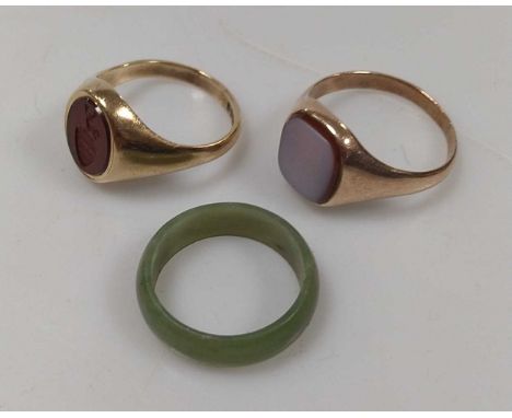 A hallmarked 9ct gold hardstone intaglio ring with crest, weight 5.8g, together with a hardstone signet ring, stamped '9CT', 