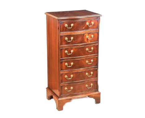 MAHOGANY SERPENTINE FRONT SIX DRAWER CHEST WITH BRASS DROP HANDLES. RAISED ON BRACKET FEET. HEIGHT: 39 INCHES. WIDTH: 19½ INC