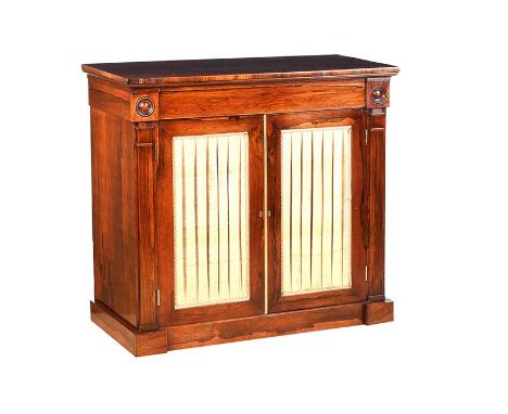 REGENCY ROSEWOOD TWO DOOR SIDE CABINET WITH SILK PLEATED PANEL DOORS. RAISED ON A BLOCK PLYNTH BASE. HEIGHT: 30 INCHES.WIDTH: