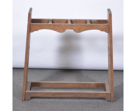 Edwardian oak stick stand, the top with three dividers, fretted sides, lacking tray, width 74cm, depth 25cm, height 73cm.