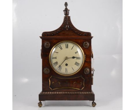William IV mahogany bracket clock, the case with acorn finial, scrolled pediment, side brass handles the front with rosettes 