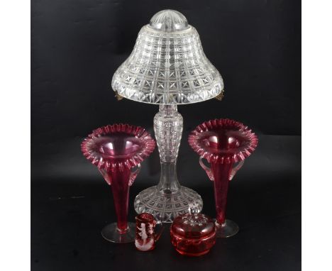 A tall cut glass table lamp, slender baluster column, with shaped mushroom shade, 57cm; pair of cranberry glass Jack in the P