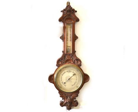 Victorian oak cased barometer, carved banjo case, silvered dials, 106cm.