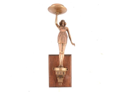 An Art Deco wall mounted light fitting, lacquered metal, designed as a lady holding a lamp, 43cm to top of the fitment, lacki