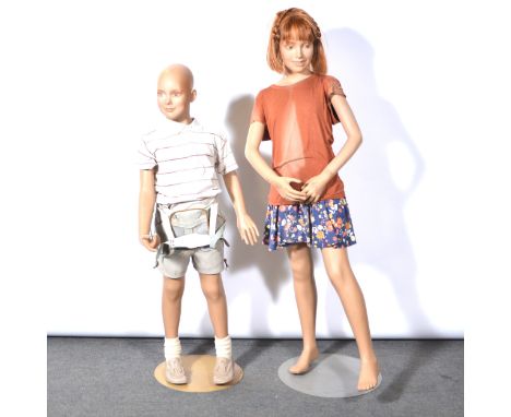 Vintage shop mannequin, NP6C, modelled as a boy, height 124cm, and another of a girl, height 142cm.