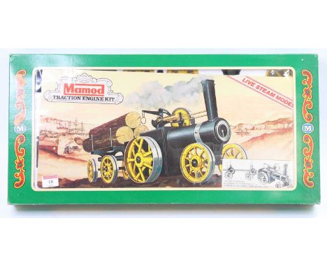 A Mamod boxed traction engine kit housed in the original green ground window display packaging with pictorial inner card, mod