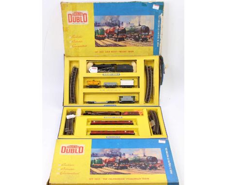 Two Hornby-Dublo 2-rail train sets: No. 2025 2-8-0 Heavy Freight comprising BR black loco 48109, with five correct wagons, tr