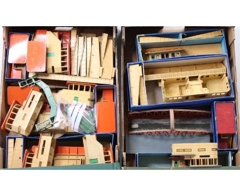 Two large trays containing Hornby-Dublo D1 metal buildings. Most are (F-G). A few are boxed (BP-F): 2 Through Stations; 2 isl