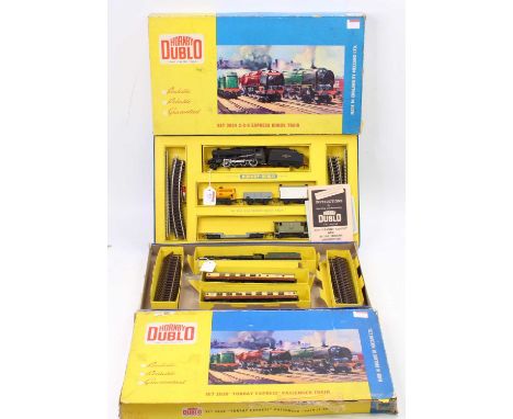 Two Hornby- Dublo 2-rail train sets: No. 2024 2-8-0 Heavy Freight comprising BR black loco 48073 with Ringfield motor, with f