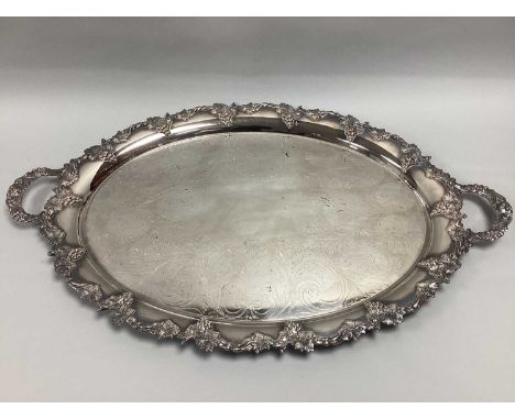 A Large Highly Decorative Silver on Copper Twin Handled Oval Serving Tray, scrolling foliage design to centre, within foliage