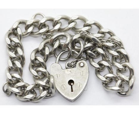 Vintage 1970s silver charm bracelet with padlock and safety chain, L: 16 cm, 20g. P&amp;P Group 1 (£14+VAT for the first lot 