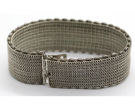 Unmarked presumed  silver mesh bracelet with safety chain. P&amp;P Group 1 (£14+VAT for the first lot and £1+VAT for subseque