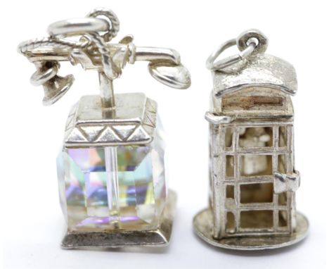 Two 1970s solid silver charms, one in the style of a telephone box, 12.5g. P&amp;P Group 1 (£14+VAT for the first lot and £1+