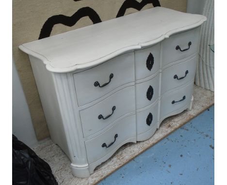 COMMODE CHEST, white, of shaped form with three drawers, 57cm D x 86cm H x 128cm W.