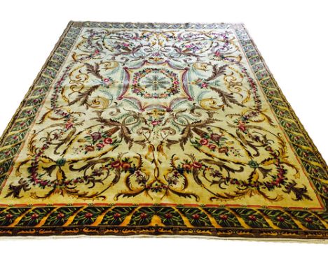 FINE SAVONNERIE DESIGN CARPET, 326cm x 245cm, central swag medallion on a rose and vine ivory field within complimentary bord